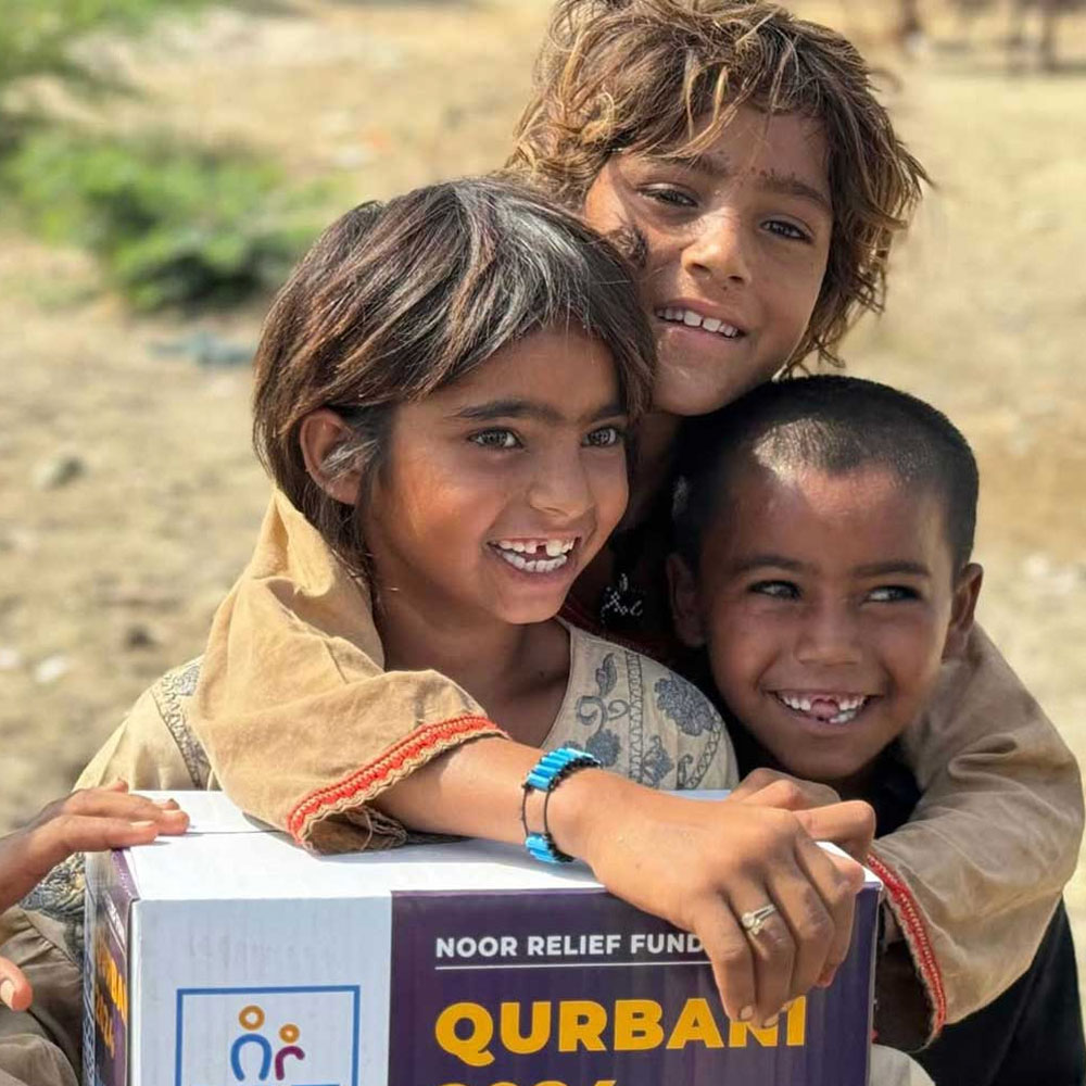 kids-holding-qurbani-box-humanitarian-aid-pakistan